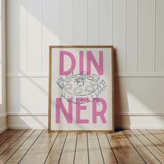 a pink poster with the words din ner on it in front of a white wall