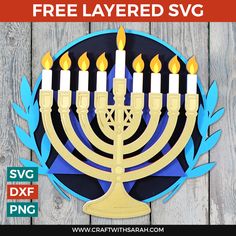 a paper menorah with lit candles on it and the text free layered svg