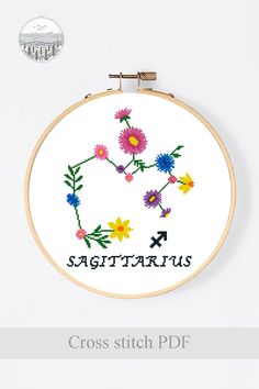 a cross stitch pattern with the words sagittarius and flowers on it's side