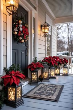 christmas decorations on the front porch with lanterns and poinsettis