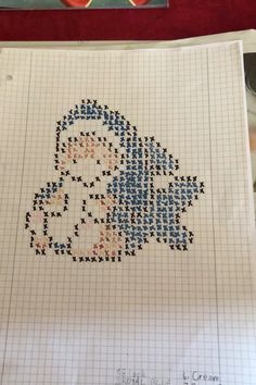 the cross stitch pattern is being worked on