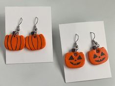 Screw-back clipons are available! Message to get them for no extra charge! Handmade paper clay earrings. Cute pumpkins and jack-o-lanterns! Painted with acrylic paint and sealed with a varnish. These earrings will bring a spooky and fall vibe to any outfit and give a fun personality. Celebrate Halloween or simply add to your autumn attire with these cute pumpkins! Disclaimer: product is handmade and may have minor imperfections or not look exactly like listing photo. We try our best to keep high quality products. Clay Earrings Cute, Clay Pumpkin, Cute Pumpkins, Fun Personality, Pumpkin Jack, Wedding Gift Baskets, Earring Designs, Earrings Cute, Paper Clay