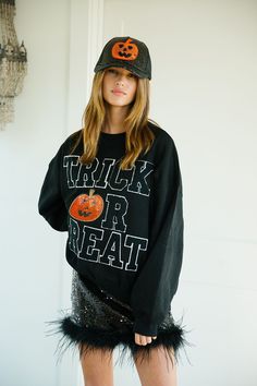 Get ready to slay this Halloween with the TRICK OR TREAT PUMPKIN BLACK PULLOVER! This black pullover features bold black varsity letters spelling out "Trick Or Treat" and an eye-catching orange sequin pumpkin patch. Stand out from the crowd and show off your festive spirit with this playful and fun pullover. All orders are currently shipping within 14 business days. To receive item quicker, expedited shipping is available at checkout. Black Long Sleeve Sweatshirt For Game Day, Black Sweatshirt For Game Day In Fall, Black Tops With Ribbed Cuffs For Game Day, Trendy Black Sweatshirt For Fall, Fall Black Letter Print Sweatshirt, Black Letter Print Sweatshirt For Fall, Sporty Black Sweatshirt For Fall, Trendy Black Halloween Sweatshirt, Halloween Streetwear Sweatshirt With Letter Print