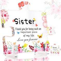 a mother's day card with flowers and butterflies on it, next to two pens