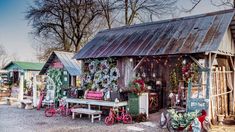 an old shed with christmas decorations on the outside