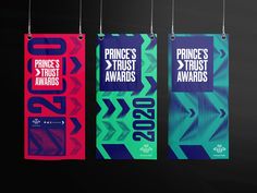 three banners hanging from strings with the words prince's trust awards