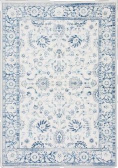 a blue and white rug with an ornate design on the bottom, in front of a white background