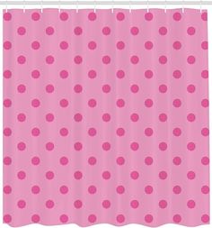 a pink shower curtain with polka dots on it