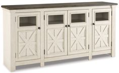 the sideboard is white and has four doors on each side, one door open to reveal