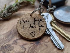 a wooden keychain with the words i love forget i have you written on it