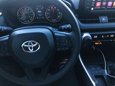 the interior of a car with various gauges and controls