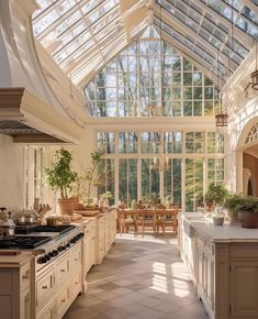 a kitchen filled with lots of counter top space next to a dining room table and chairs