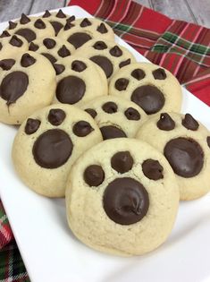 chocolate chip cookies are arranged on a white plate