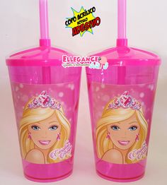 two pink plastic cups with barbie dolls on the side and one has a tiara