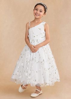 Ivilia is our sweet and joyful flower girl A-line dress made from our embroidered tulle. She features a one shoulder neckline. The A-line skirt has box pleating that creates a playful yet sophisticated silhouette. Junior Flower Girl Dresses, Tea Length Tulle, Ivory Flower Girl, Ivory Flower Girl Dresses, Girls White Dress, Ivory Flower, Tulle Flower Girl