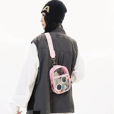 a person wearing a black jacket and pink backpack