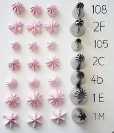 several different types of pink bows are displayed on a white board with black pins and numbers