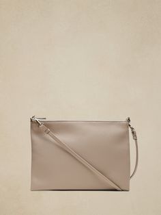 Behold: the perfect carry-it-everywhere bag in a not-too-big size.  Crafted in soft leather, this bag has a fully detachable shoulder strap so you can wear it crossbody, on your shoulder, or carry it as a clutch.  Zip top closure.  Interior slip pock Elegant Soft Leather Clutch For On-the-go, Versatile Clutch Shoulder Bag For On-the-go, On-the-go Shoulder Bag With Removable Pouch Clutch, On-the-go Clutch Shoulder Bag With Detachable Handle, On-the-go Clutch Bag With Detachable Strap, Versatile Leather Clutch With Zipper Closure, Versatile Shoulder Bag Clutch With Zipper, Versatile Shoulder Bag Clutch With Zipper Closure, Versatile Soft Leather Clutch Bag