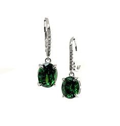 Beautiful 10X8mm Oval AAA Lab Created Emerald  Lever Back Earrings. With Pave Set White Sapphire Accents. Solid .925 Sterling Silver Limited Time Promotion Priced Wrapped & ready to give in a Laced Blue Gift Box  Fast Free Shipping From South Florida, Classic Green Earrings With Ear Wire, Classic Teardrop May Birthstone Earrings, Classic Teardrop Earrings For May Birthstone, Formal Earrings For May Birthstone, Elegant Nickel-free Emerald Earrings, Fine Jewelry Oval Sterling Silver Earrings, Oval Sterling Silver Earrings Fine Jewelry, Classic Oval Earrings With Ear Wire, Classic Nickel-free Oval Earrings