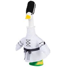 an inflatable duck wearing a black hat and white dress with green feet is standing upright