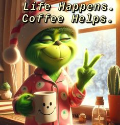 the grinch is holding a coffee cup in his hand and giving the peace sign