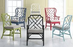 the chairs are all different colors and have white cushions on each one, while the rest of the chair is multicolored