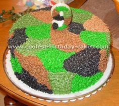 a camouflage cake is decorated with green and brown icing