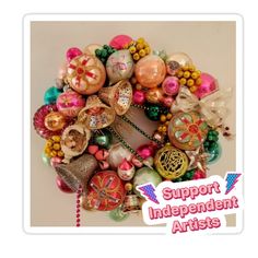 an image of a wreath with ornaments on it that says support independent arts's