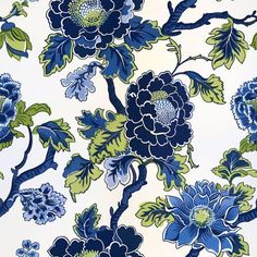 a blue and green flowered wallpaper with large flowers on it's side