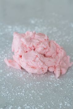 a pile of pink food sitting on top of a table