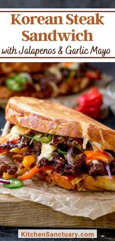 korean steak sandwich with jalapenos and garlic mayo on a wooden cutting board