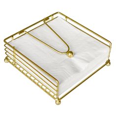 a gold metal tray with a white sheet in the middle and two handles on each side