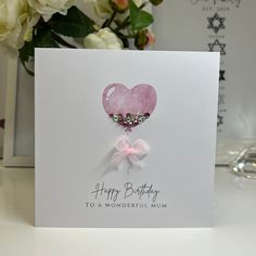 a birthday card with a pink heart on it