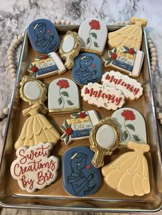 decorated cookies in the shape of disney characters