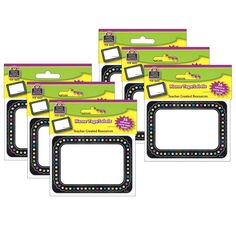 four pack of black and white photo frames with colored dots on the front, one is blank