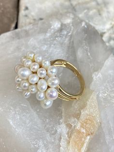 Vintage 14K Yellow Gold High Luster White Pearl Cluster Tri-Shank Ring Size 5.75 Ring Size: 5.75 Metal Purity: 14K Metal Type: Yellow Gold Main Stone: Pearl Setting Style: Cluster Sizable:  Yes Weight: 8.7g J0635 Prompt FREE Shipping FREE Easy Returns Fine Jewelry Yellow Gold Pearl Ring With High Luster, Luxury White Cluster Pearl Ring, Elegant Yellow Gold Multi-stone Pearl Ring, Vintage Gold Hallmarked Pearl Ring, Pearl Setting, Pearl Cluster Ring, San Jacinto, Pearl Cluster, White Pearl