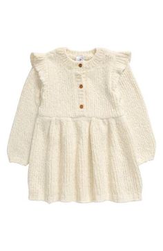 Colder temps call for a cozy dress like this adorable knit style with tiny ruffles at the shoulders and metallic threads shimmering throughout. 96% polyester, 4% metallic fibers Machine wash, tumble dry Imported Baby Sweater Dress, Winter White Dress, White Dress Winter, Knit Baby Dress, Cozy Dress, Baby Sweater, Long Sleeve Knit Dress, Knit Style, Baby Sweaters