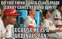 a group of baseball players sitting next to each other with caption that reads do you think santa claus made candy canes red and white because he is a cardinals fan?