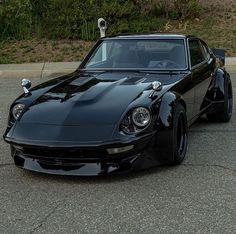 a black sports car parked on the street