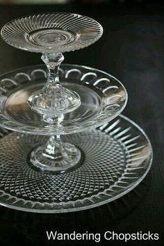 three clear glass cake plates sitting on top of each other