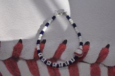 Show off your favorite team with one of these bracelets. Here I have New York Yankees made with White and Blue seeds beads, white plastic letters, beading wire, 1 Baseball bead, and a lobster clasp. If you need something different please email me. Thanks for your business! Please don't forget to like my shop. Yankees Bracelet, New York Yankees Bracelet, Team Bracelet, Sports Bracelet Blue Sporty Bracelet For Sports, Sporty Blue Bracelet For Sports, Sporty Beaded Bracelets For Sports Events, Sporty Blue Bracelets For Sports Events, Team Bracelets, Baseball Bracelet, Plastic Letters, New York Yankees Baseball, Sports Bracelet