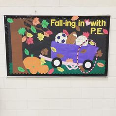 a bulletin board with an image of a car and pumpkins