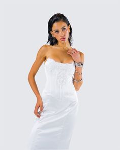 They’ll all be getting down on one knee when they see you in this dress 💍 Made from soft satin fabric, this gorgeous white lace appliqué gown, complete with a fit and flare style and corset boning, will leave a trail of admirers in your wake 🤍 White Fitted Corset Dress With Ruched Bodice, Lace Gown With Boned Bodice And Sweetheart Neckline, Lace Evening Dress With Boned Bodice And Sweetheart Neckline, Lace Dress With Boned And Fitted Bodice, Lace Evening Dress With Corset Back And Fitted Bodice, Elegant Fitted Lace Trim Bodice, Elegant Dress With Lace Bodice, Fitted Lace Corset For Wedding Night, Fitted Lace Back Gown For Debutante Ball