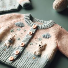 a knitted sweater with two teddy bears on the front and one bear in the back