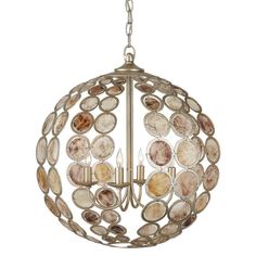 a chandelier hanging from the ceiling with shells on it and two candles inside