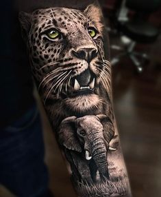 an animal tattoo on the arm of a man with yellow eyes and leopard's head