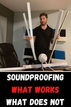 a man standing in front of a desk holding up two large poles with the words soundproofing what works what does not