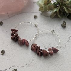 Sterling Silver Rhodonite Hoop Earrings.  Handcrafted with care and a deep appreciation for the natural beauty of rhodonite, these earrings are the perfect accessory for those who seek a harmonious blend of elegance and the gentle healing properties of this unique gemstone. Each hoop earring is adorned with genuine rhodonite nugget beads, known for their soft pink hues and loving energy. Rhodonite is believed to promote emotional healing, self-love, and compassion, making these earrings not only Stocking Fillers For Teenagers, Rhodonite Crystal, Loving Energy, Crystal Hoop Earrings, Earrings Christmas, Unique Gemstones, Sterling Silver Hoops, Emotional Healing, Christmas Present