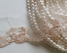 pearls and lace on a white cloth