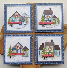 four cards with houses and trees on them, one for christmas the other for new year's eve